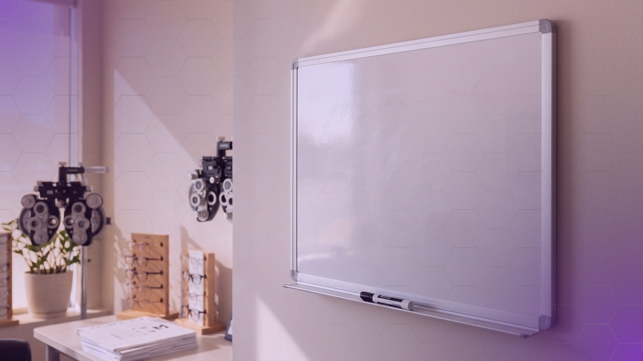Editorial scene of a whiteboard beside a phoropter in an eye care practice, soft purple accent lighting